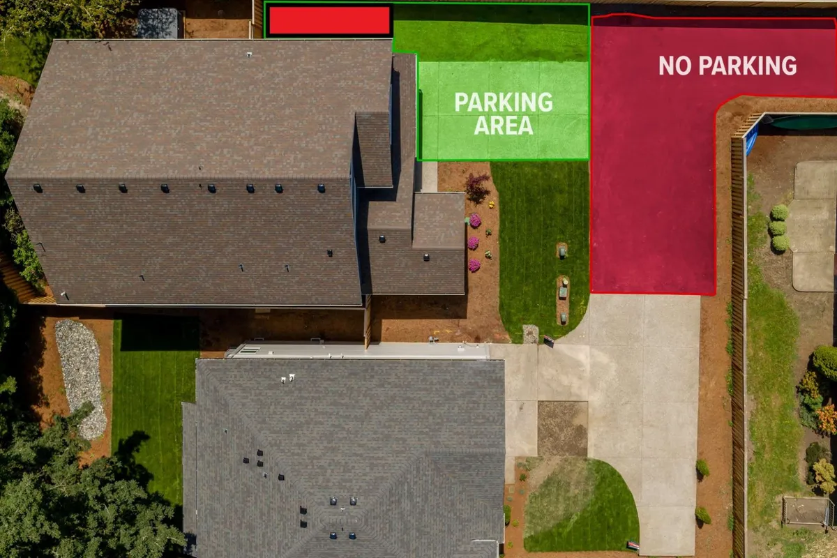 This exterior image shows a well-maintained parking area bordered by landscaped gardens and highlighted by a clear 'no parking' sign. The space is open and inviting, indicating easy access for visitors and guests, with greenery that ties in the natural surroundings.